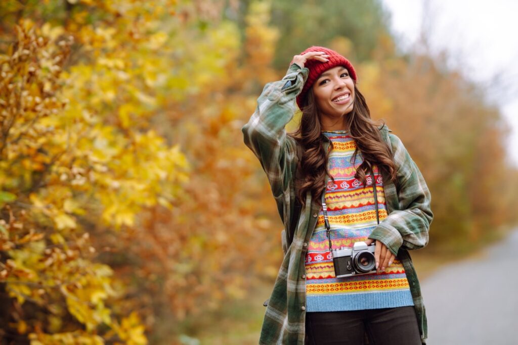 Beautiful Young Woman Is Photographed With Retro Camera. Rest, Relaxation, Travel, Lifestyle Concept